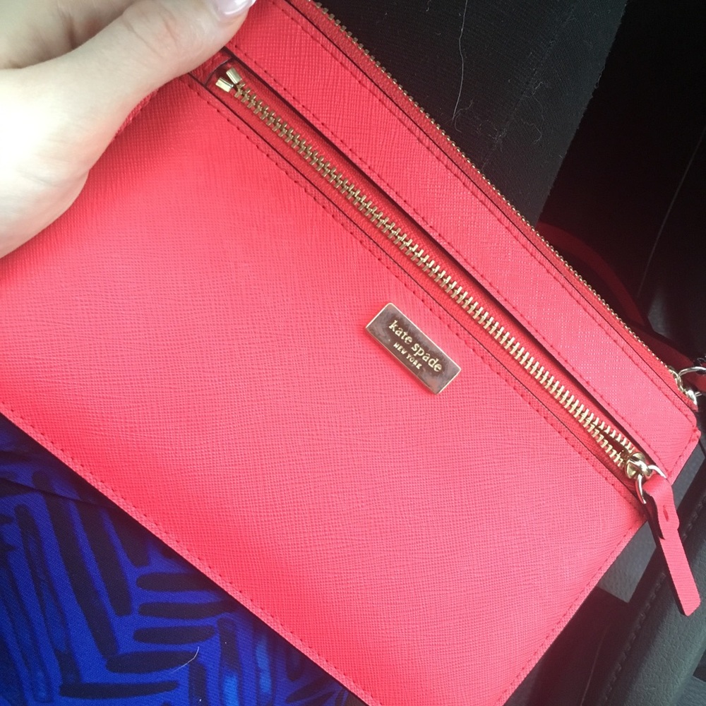 Pink kate spade wristlist with zipper